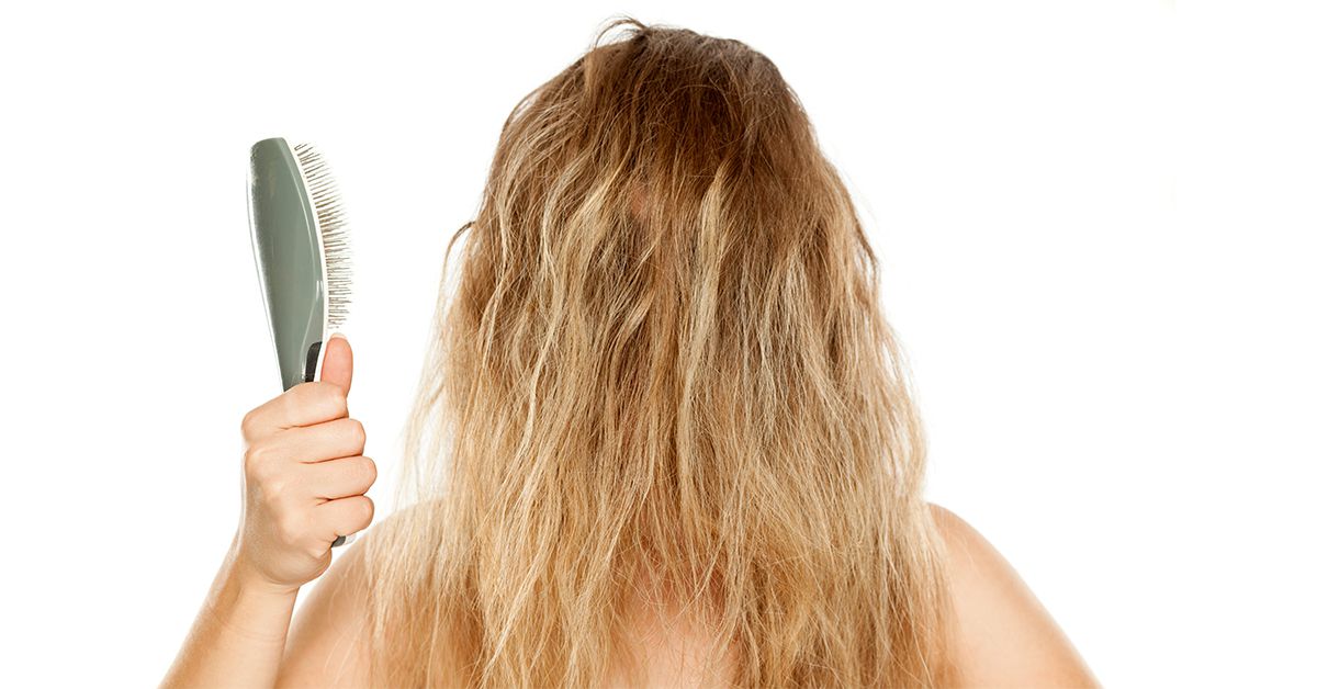 Woman displaying frizzy hair