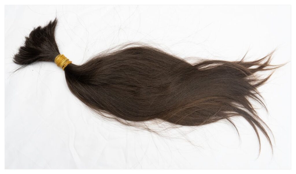 A high quality raw hair bundle on a white background